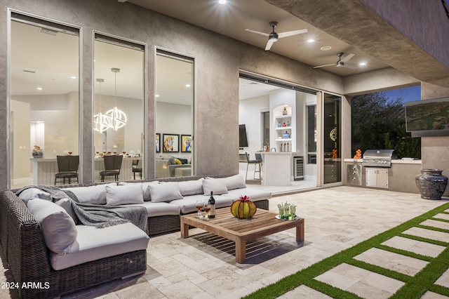 view of patio with ceiling fan, a grill, an outdoor living space, and beverage cooler