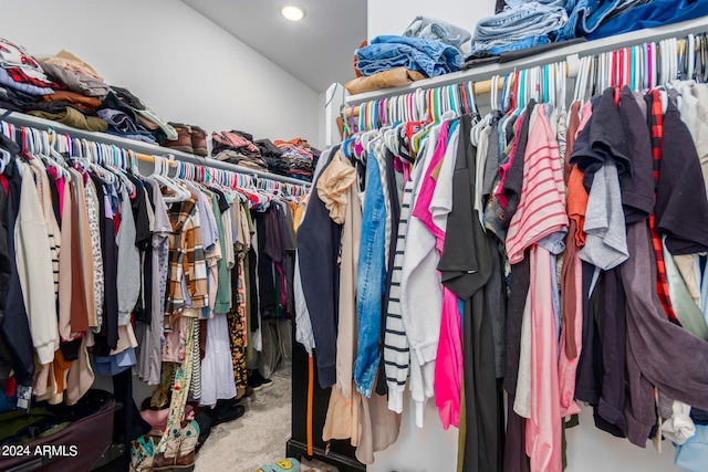 walk in closet featuring carpet