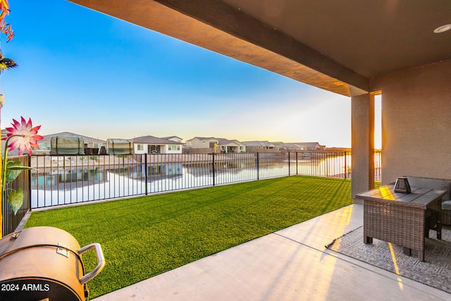 view of yard with a water view and a patio area