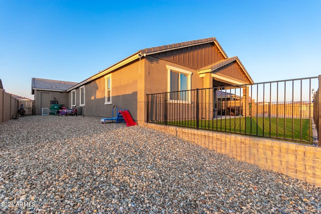 view of side of property with a yard