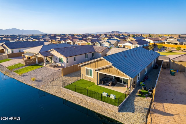 bird's eye view with a water and mountain view