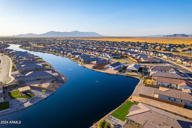 drone / aerial view with a water and mountain view