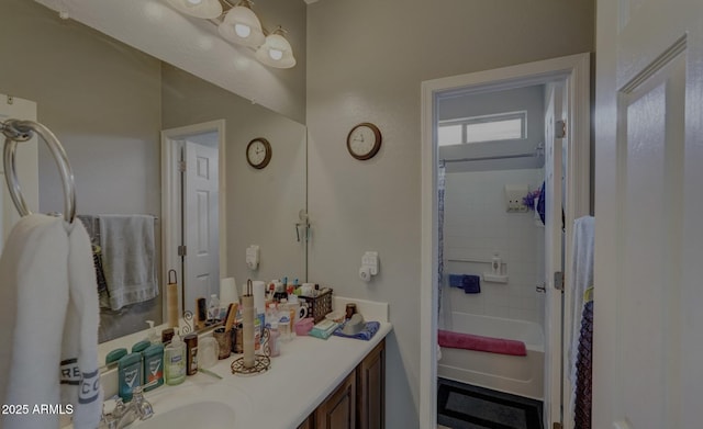 bathroom with shower / bath combination with curtain and vanity