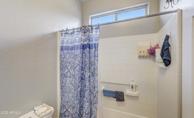 bathroom featuring shower / tub combo with curtain