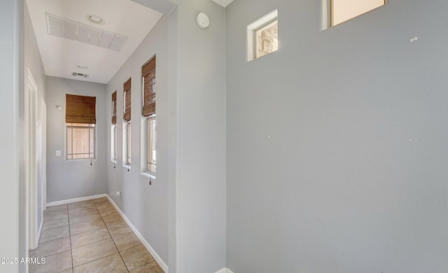 hallway with light tile patterned floors