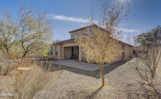 back of house featuring a patio area