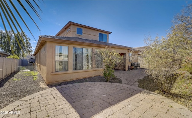 back of house featuring a patio