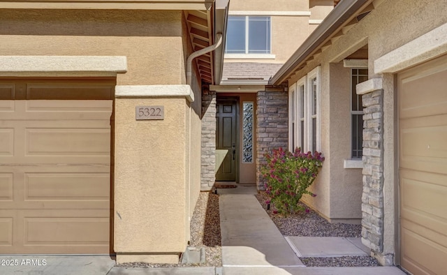 view of exterior entry featuring a garage