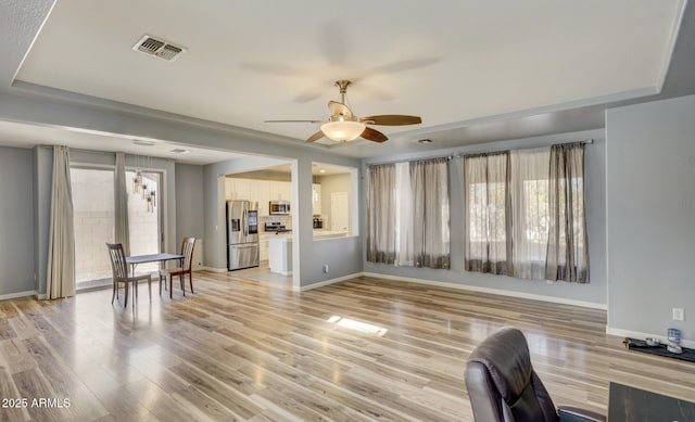 interior space featuring light hardwood / wood-style flooring and ceiling fan