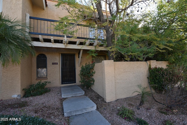 entrance to property with a balcony