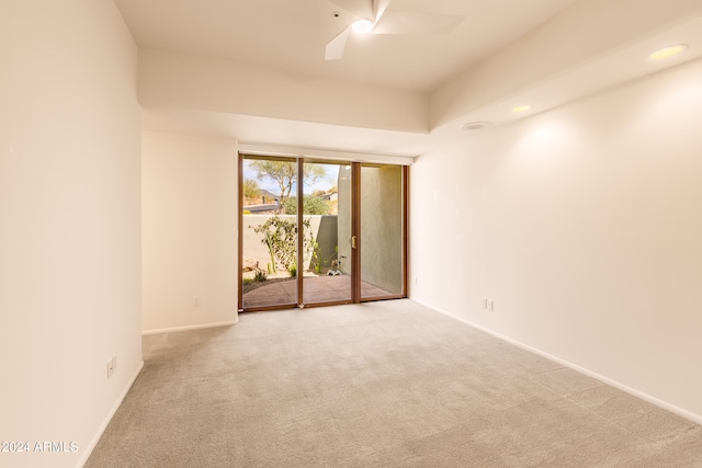 unfurnished room featuring ceiling fan and light colored carpet