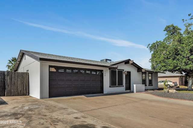 156 E Jasmine St, Mesa, AZ 85201 - view of front of property featuring a garage, concrete driveway, and stucco siding