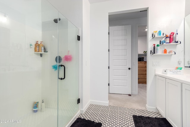 bathroom featuring vanity and an enclosed shower