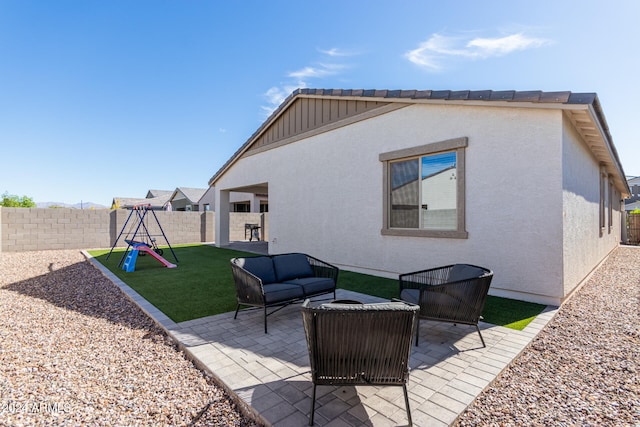 view of patio / terrace featuring a playground and outdoor lounge area