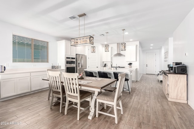 dining room featuring light hardwood / wood-style flooring