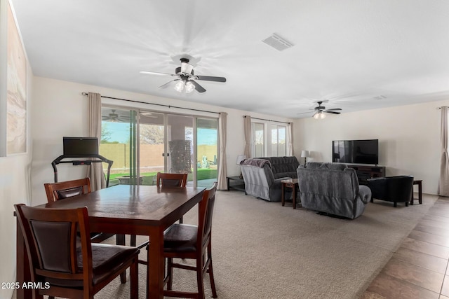 dining room with a ceiling fan and visible vents