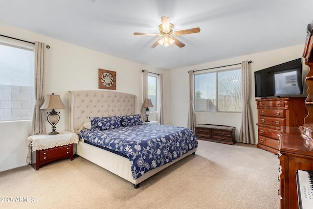 carpeted bedroom with a ceiling fan