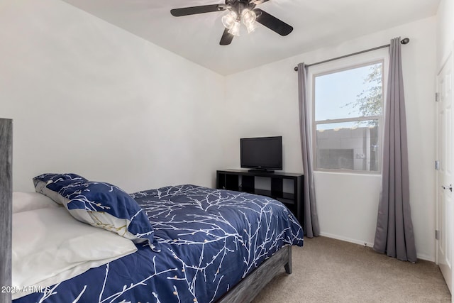 bedroom featuring carpet floors, a ceiling fan, and baseboards