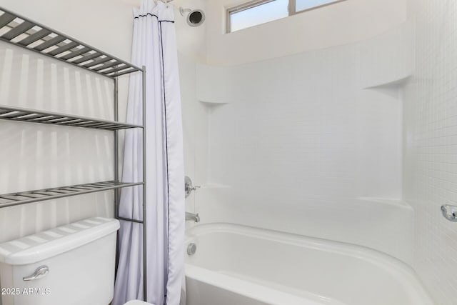 bathroom with shower / tub combo and toilet