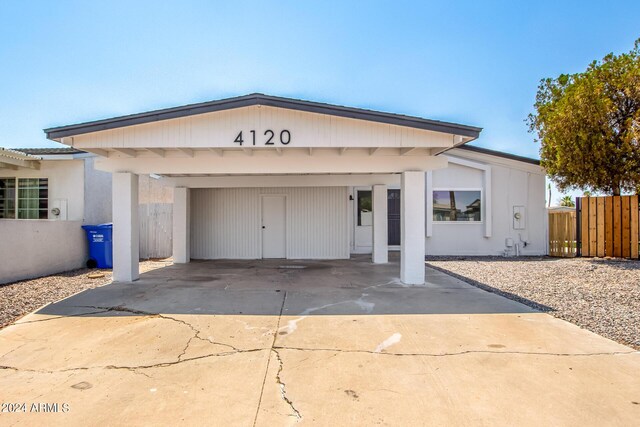 view of front of home featuring a carport