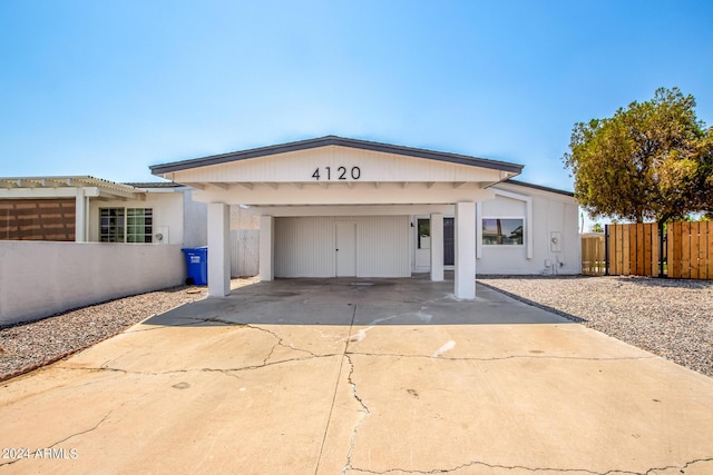 view of front facade with a carport