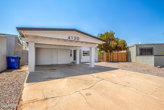 view of front of home with a carport