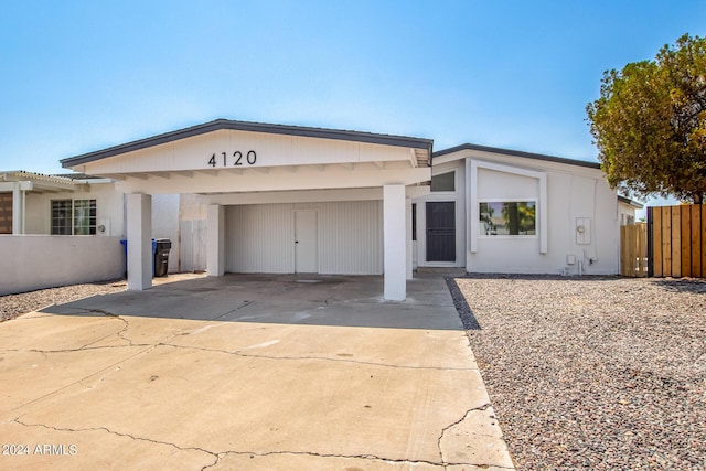 view of front of house featuring a carport