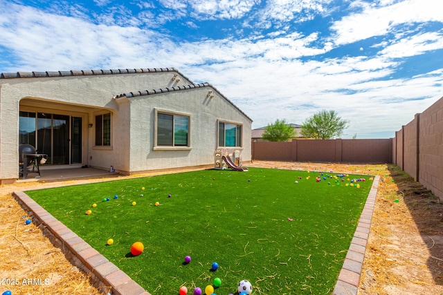 rear view of house with a patio