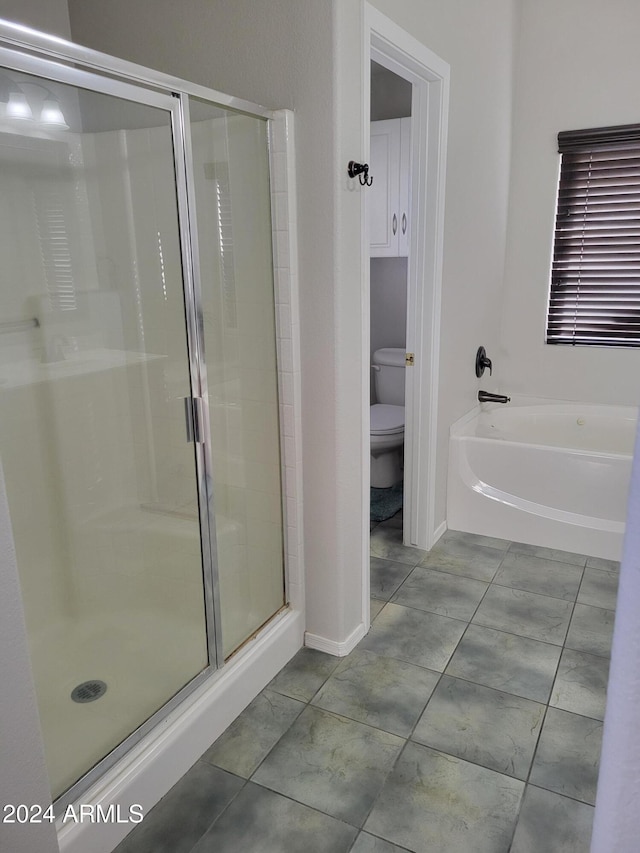 bathroom featuring independent shower and bath, toilet, and tile patterned floors