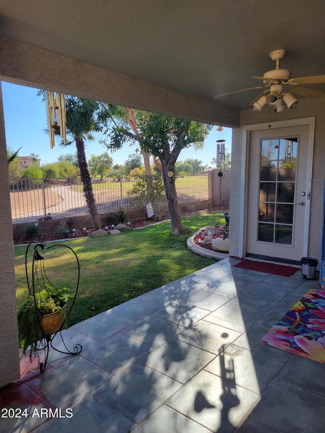 view of patio / terrace featuring ceiling fan