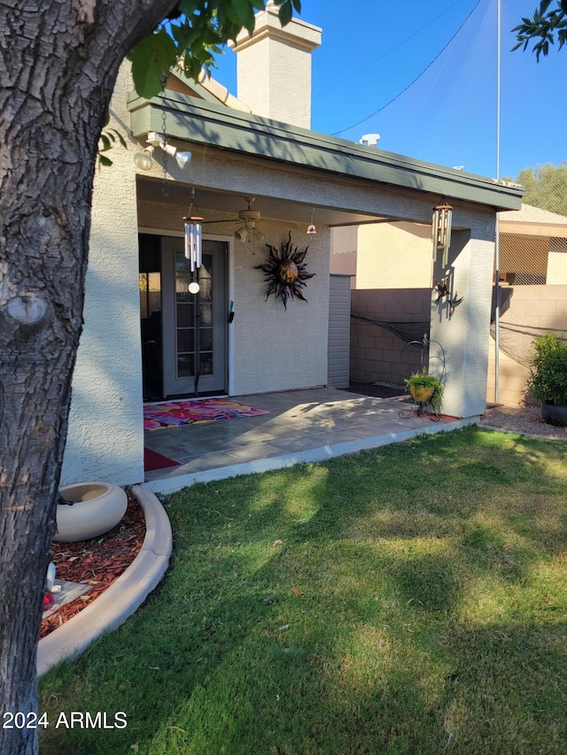 property entrance with a yard