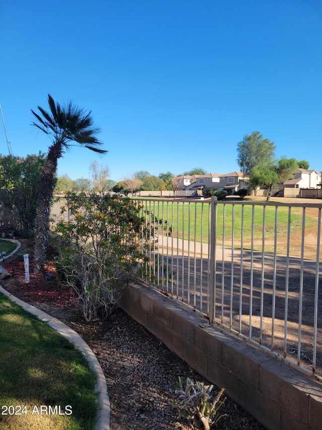 view of gate featuring a yard