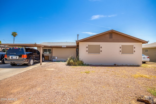 view of home's exterior featuring a carport