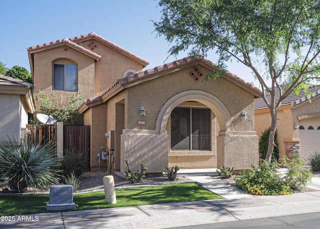 1950 W Park Pl, Chandler, AZ 85224 - mediterranean / spanish-style house featuring a tile roof, stucco siding, and fence