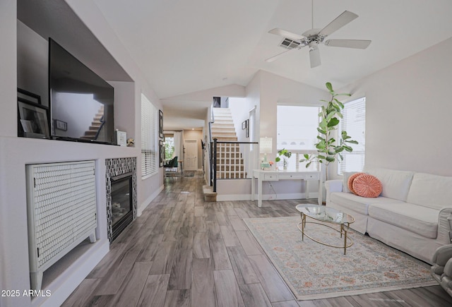 1950 W Park Pl, Chandler, AZ 85224 - living area with stairway, lofted ceiling, wood finished floors, ceiling fan, and baseboards