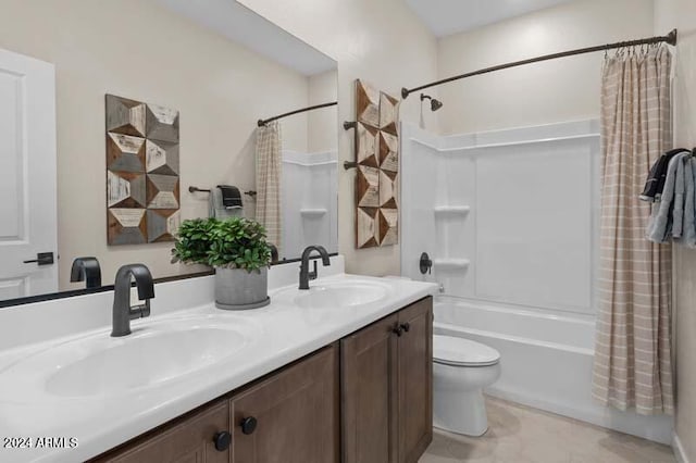 full bathroom with vanity, shower / tub combo, and toilet