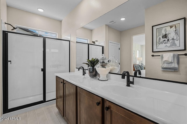 bathroom with vanity and an enclosed shower