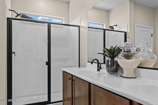 bathroom with vanity and an enclosed shower