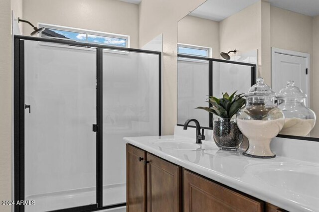 9243 E Sector Dr, Mesa, AZ 85212 - bathroom with double vanity, a wealth of natural light, a shower stall, and a sink