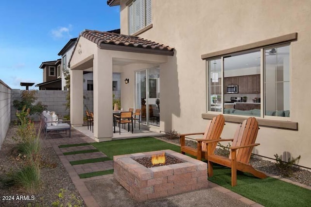 9243 E Sector Dr, Mesa, AZ 85212 - rear view of property with a patio area, stucco siding, a fire pit, and fence