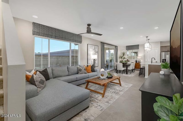 9243 E Sector Dr, Mesa, AZ 85212 - living room with concrete floors, a ceiling fan, and recessed lighting