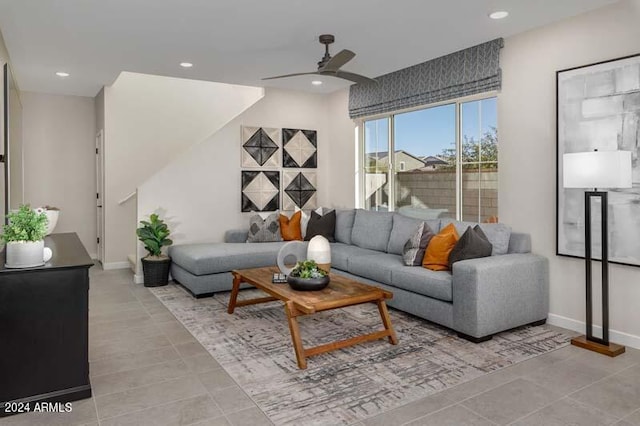 tiled living room with ceiling fan