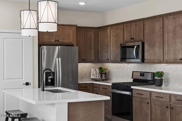 9243 E Sector Dr, Mesa, AZ 85212 - kitchen with light countertops, stainless steel appliances, an island with sink, and backsplash