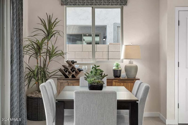 9243 E Sector Dr, Mesa, AZ 85212 - dining space featuring baseboards and light tile patterned floors