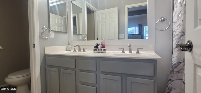 bathroom with vanity and toilet