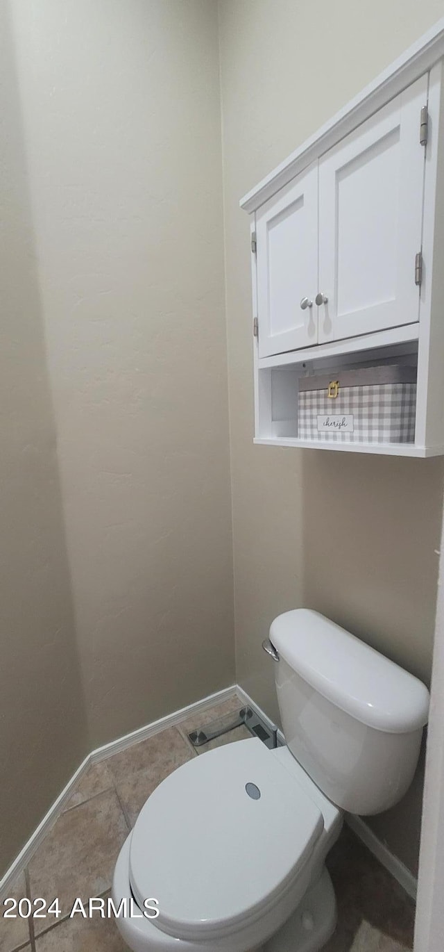 bathroom with tile patterned floors and toilet