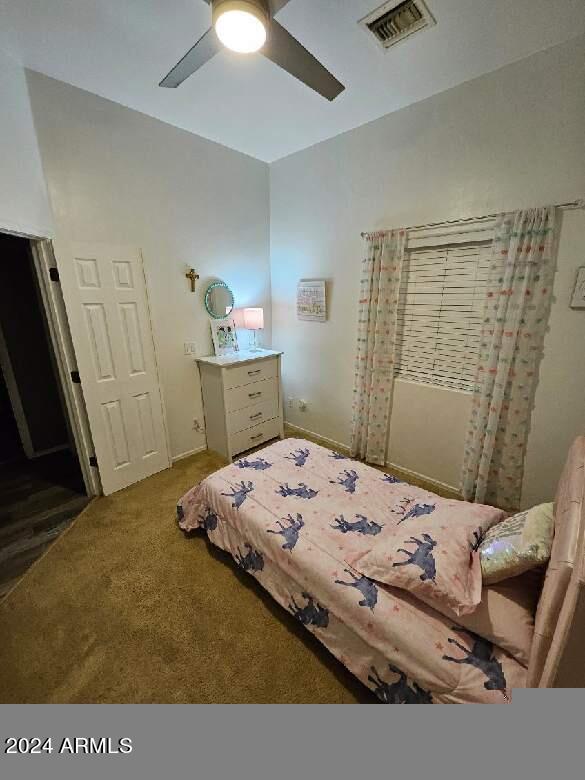 carpeted bedroom with ceiling fan