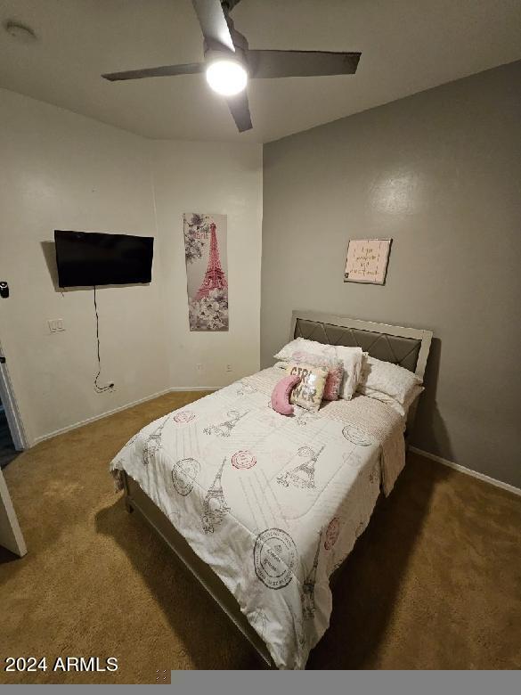 carpeted bedroom featuring ceiling fan