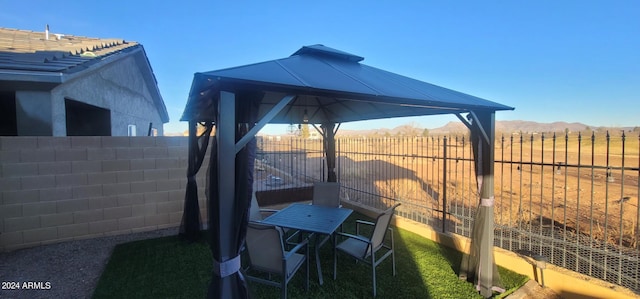 exterior space with a gazebo, a mountain view, and a rural view