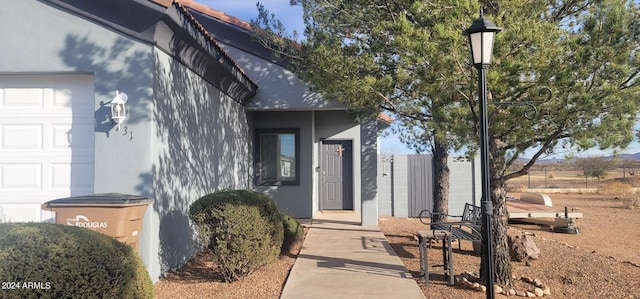 doorway to property featuring a garage